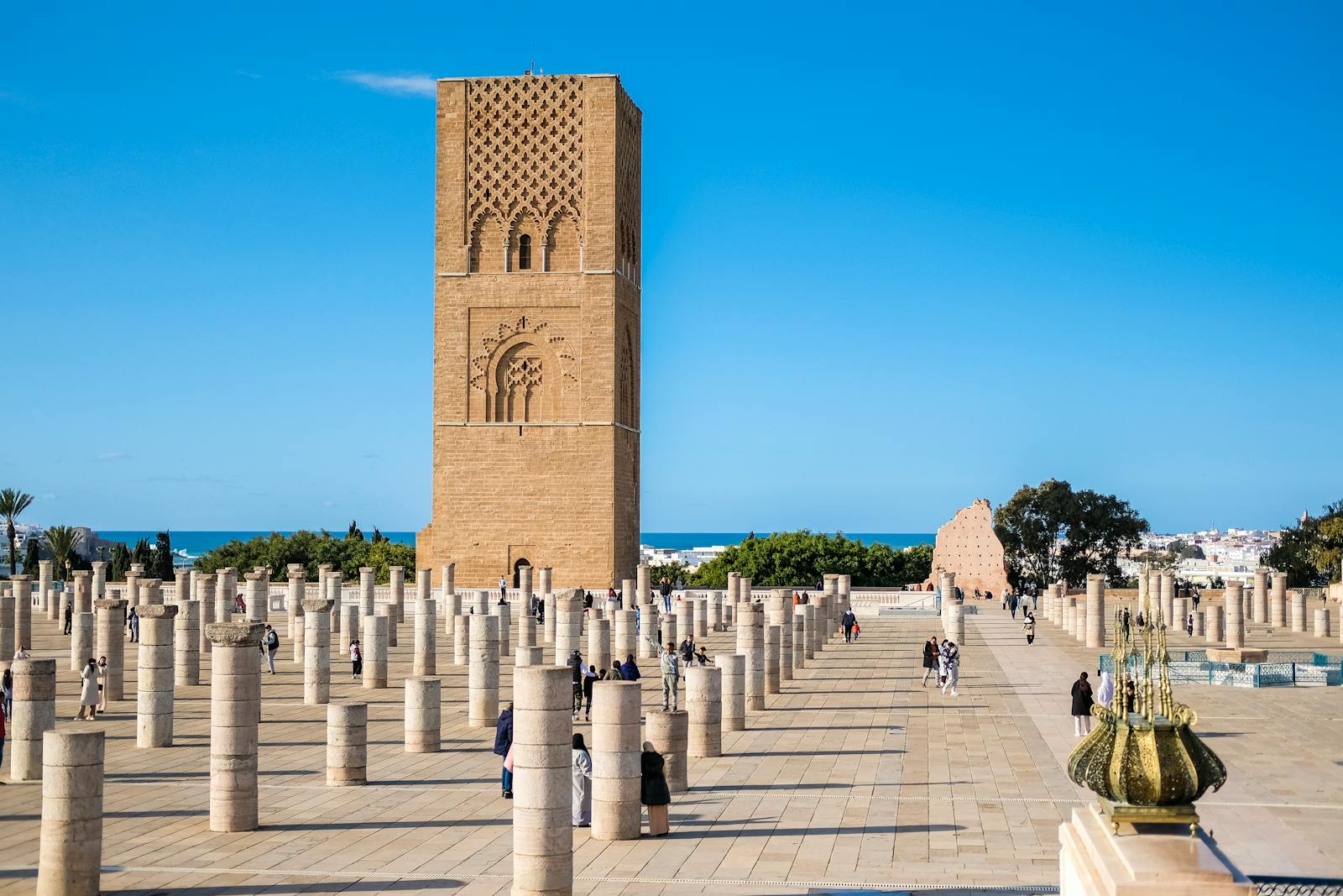 The iconic Hassan Tower amidst a sea of historical columns in Rabat, Morocco.